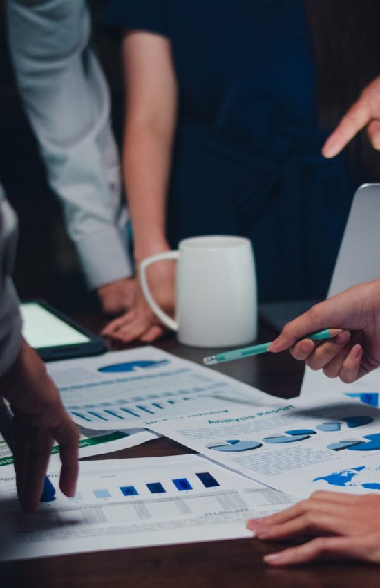 Millennial Asia businessmen and businesswomen meeting brainstorm Millennial Asia businessmen and businesswomen meeting brainstorming ideas about new paperwork project colleagues working together planning success strategy enjoy teamwork in small modern night office.